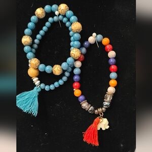 Trio Stretch Beaded Bracelet. 2 with tassels, one gold tone detail 6.5"-7"